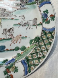 A Chinese famille verte 'Eight Horses' plate, Kangxi