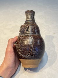 Three khmer-style brown-glazed anthropomorphic gourd-form bottles, probably 12/13th C.