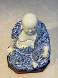 A fine Chinese blue and white Milefo Buddha on a wooden stand, Wei Hongtai Zao 魏洪泰造 mark, Republic