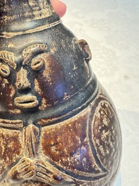 Three khmer-style brown-glazed anthropomorphic gourd-form bottles, probably 12/13th C.