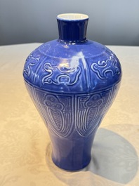 A Chinese archaistic blue-glazed vase with relief design, 20th C.