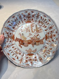 A pair of Chinese gilt iron-red-decorated 'Falconry' plates, Kangxi