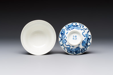 A Chinese blue and white 'Buddhist Lion' teapot, covered bowl and a saucer, various marks, 19th C.
