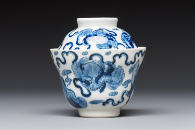 A Chinese blue and white 'Buddhist Lion' teapot, covered bowl and a saucer, various marks, 19th C.