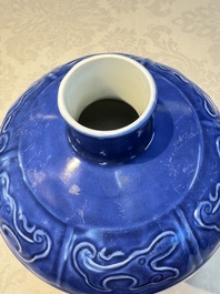 A Chinese archaistic blue-glazed vase with relief design, 20th C.