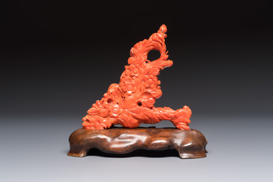 A Chinese carved red coral 'Birds and Flowers' group on a wooden stand, 19/20th C.