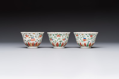 Seven Chinese famille verte cups and four saucers, conch shell and lingzhi marks, Kangxi