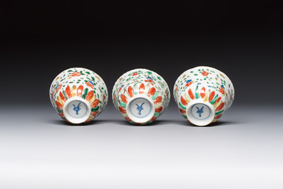 Seven Chinese famille verte cups and four saucers, conch shell and lingzhi marks, Kangxi