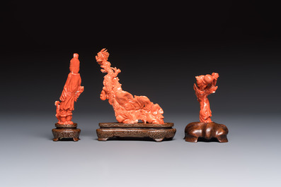 Three Chinese red coral carvings on wooden stands, 19/20th C.