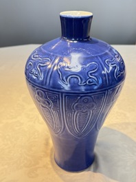 A Chinese archaistic blue-glazed vase with relief design, 20th C.