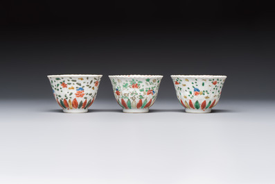Seven Chinese famille verte cups and four saucers, conch shell and lingzhi marks, Kangxi