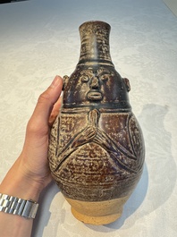 Three khmer-style brown-glazed anthropomorphic gourd-form bottles, probably 12/13th C.