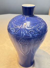 A Chinese archaistic blue-glazed vase with relief design, 20th C.