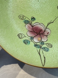 Four Chinese famille rose saucers and a gilt-decorated powder-blue-ground saucer, Qianlong and Jiaqing marks, 18/19th C.