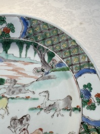 A Chinese famille verte 'Eight Horses' plate, Kangxi