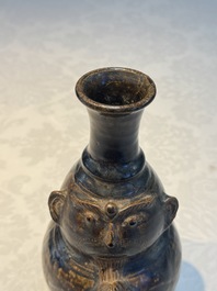 Three khmer-style brown-glazed anthropomorphic gourd-form bottles, probably 12/13th C.