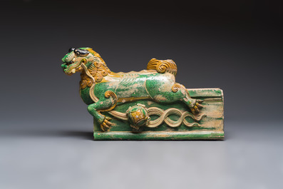 A large Chinese sancai-glazed pottery 'Buddhist Lion' roof tile, Ming