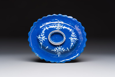 An oval French Persian-blue-ground white-decorated faience dish with butterflies and foliage, Nevers, 17th C.