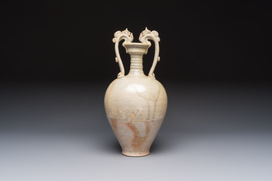 A Chinese straw-glazed pottery amphora with double dragon-shaped handles, Tang