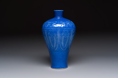 A Chinese archaistic blue-glazed vase with relief design, 20th C.