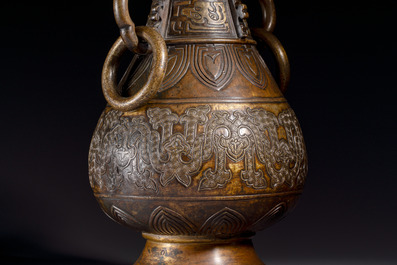 A fine and large Chinese archaistic gilt-bronze vase with handles, Ming
