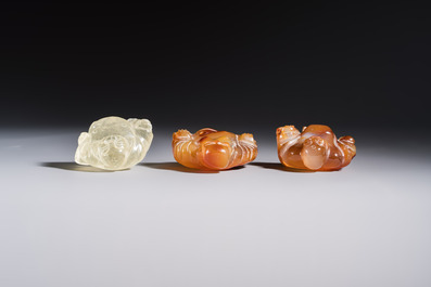 A Chinese carved rock crystal Milefo Buddha and two agate Milefo Buddhas, 19/20th C.