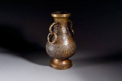 A fine and large Chinese archaistic gilt-bronze vase with handles, Ming