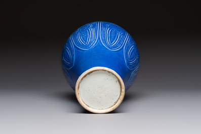 A Chinese archaistic blue-glazed vase with relief design, 20th C.