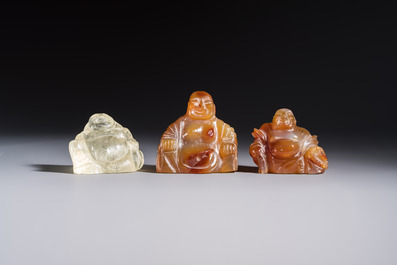 A Chinese carved rock crystal Milefo Buddha and two agate Milefo Buddhas, 19/20th C.