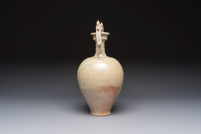 A Chinese straw-glazed pottery amphora with double dragon-shaped handles, Tang