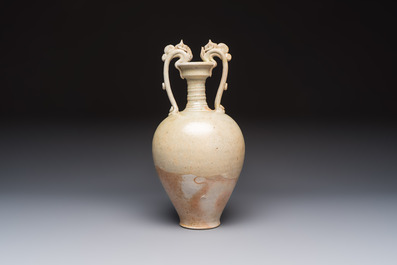 A Chinese straw-glazed pottery amphora with double dragon-shaped handles, Tang
