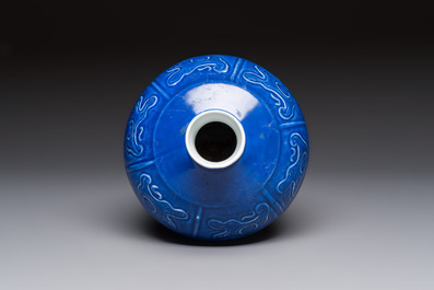 A Chinese archaistic blue-glazed vase with relief design, 20th C.