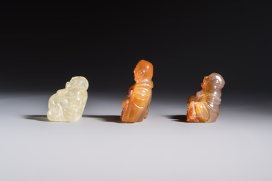 A Chinese carved rock crystal Milefo Buddha and two agate Milefo Buddhas, 19/20th C.