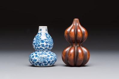 A Chinese blue and white double-gourd snuff bottle and a huali snuff bottle, Xuande and Qianlong mark, 19th C.
