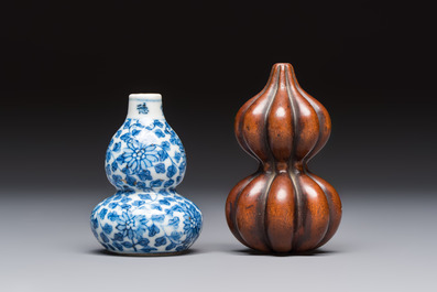 A Chinese blue and white double-gourd snuff bottle and a huali snuff bottle, Xuande and Qianlong mark, 19th C.
