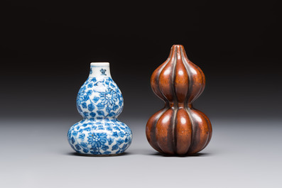 A Chinese blue and white double-gourd snuff bottle and a huali snuff bottle, Xuande and Qianlong mark, 19th C.