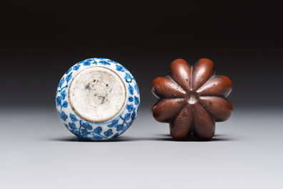A Chinese blue and white double-gourd snuff bottle and a huali snuff bottle, Xuande and Qianlong mark, 19th C.