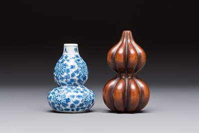 A Chinese blue and white double-gourd snuff bottle and a huali snuff bottle, Xuande and Qianlong mark, 19th C.