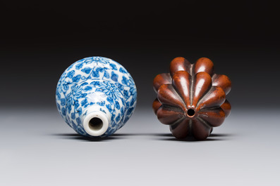 A Chinese blue and white double-gourd snuff bottle and a huali snuff bottle, Xuande and Qianlong mark, 19th C.