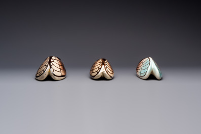 A collection of 19 French &lsquo;Cicada&rsquo; wall pocket vases, 20th C.