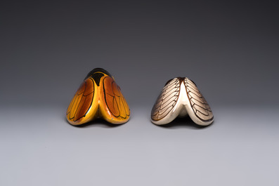 A collection of 19 French &lsquo;Cicada&rsquo; wall pocket vases, 20th C.