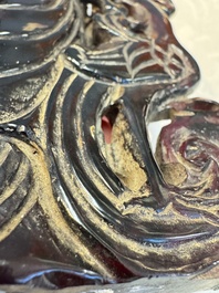 A group of ten Chinese hardstone and cherry amber carvings, 20th C.