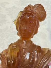 A group of ten Chinese hardstone and cherry amber carvings, 20th C.