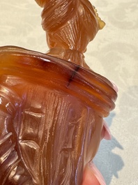 A group of ten Chinese hardstone and cherry amber carvings, 20th C.