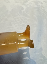 A group of ten Chinese hardstone and cherry amber carvings, 20th C.