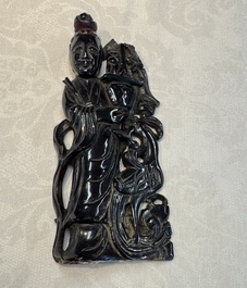A group of ten Chinese hardstone and cherry amber carvings, 20th C.