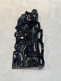 A group of ten Chinese hardstone and cherry amber carvings, 20th C.