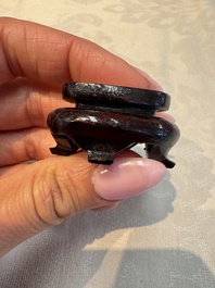 A group of ten Chinese hardstone and cherry amber carvings, 20th C.
