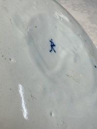 A blue and white Dutch Delft covered vase and two polychrome plates, 17/18th C.