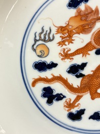 A Chinese blue and white iron-red-decorated 'Dragon' plate, Jing Jin Tang 精進堂 mark, 19th C.